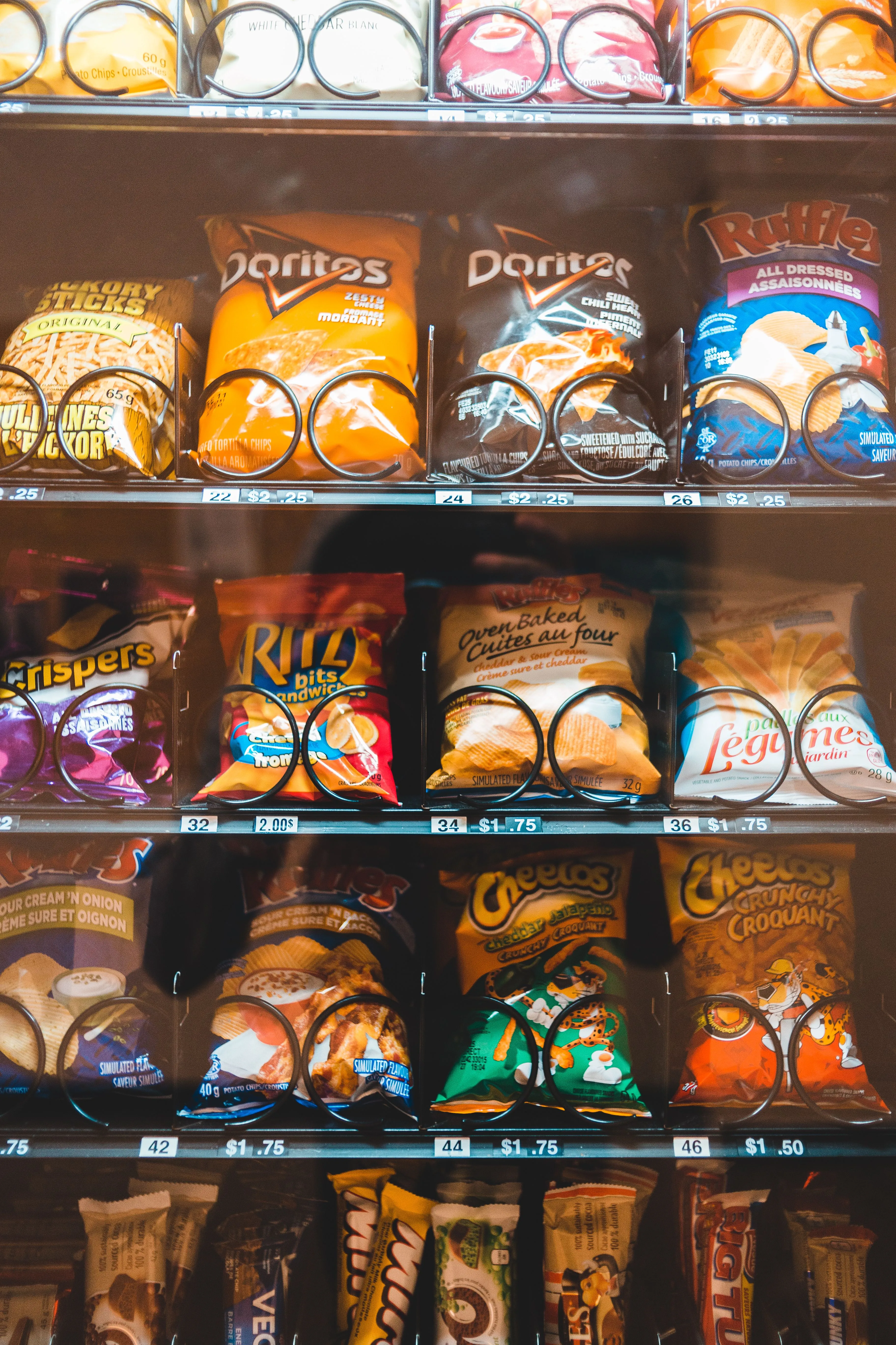A vending machine stocked with a colorful variety of snacks